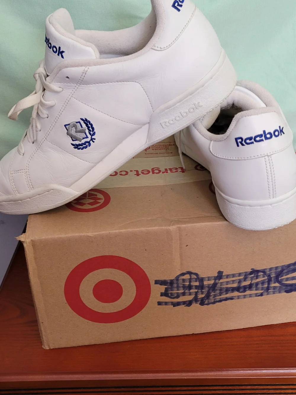 Reebok Men’s Classic White Leather Sneakers with Blue Accents